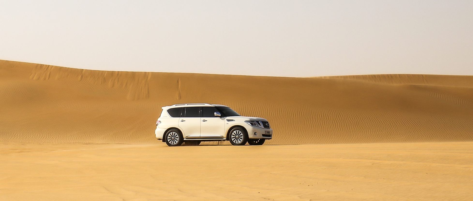 white-vehicles-on-desert